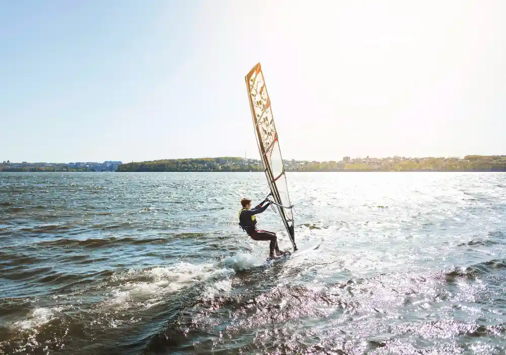 Tourist enjoying windsurfing in Abu Soma, Egypt, one of the top water sports to do in Abu Soma on the Red Sea.